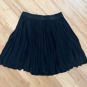 black pleated circle skirt